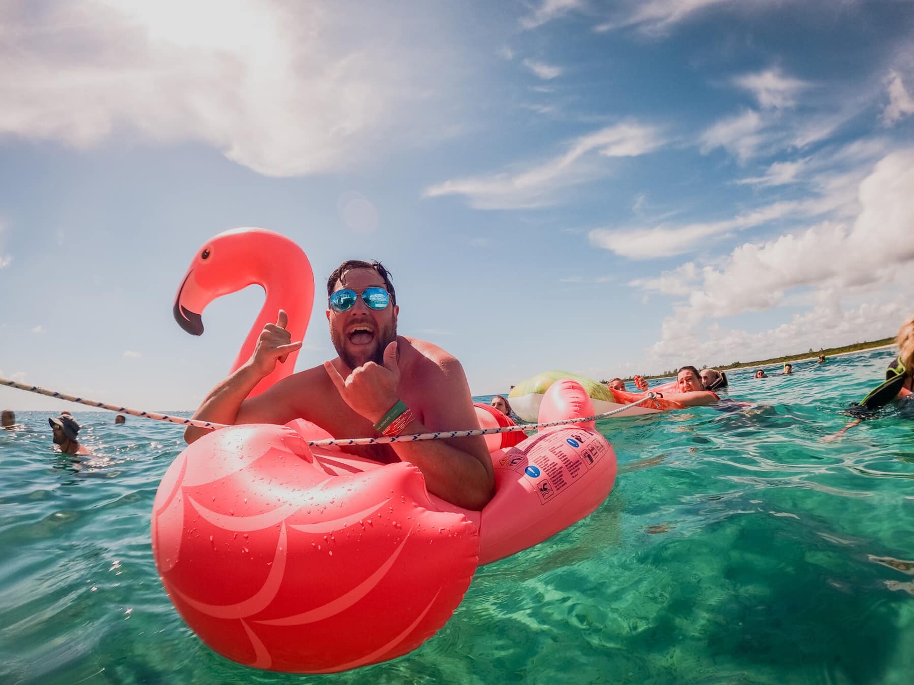 Guest relaxing in the water during a yacht charter